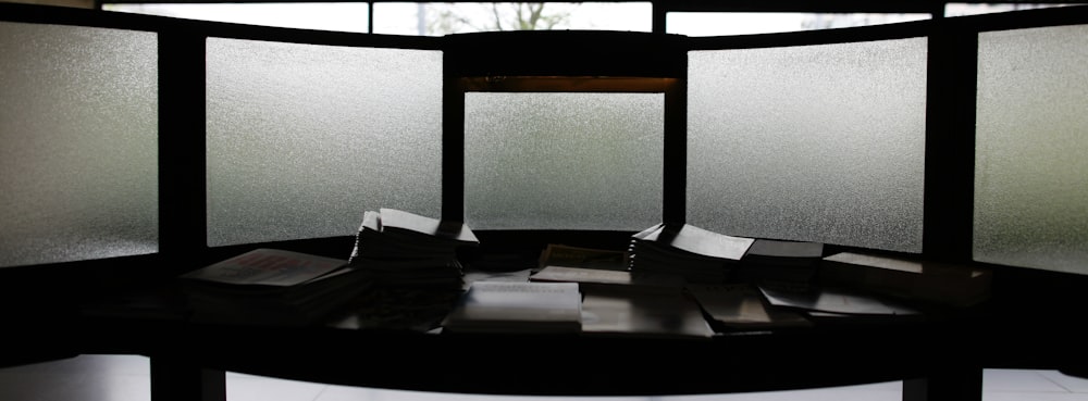 a room divider with a bunch of papers on top of it