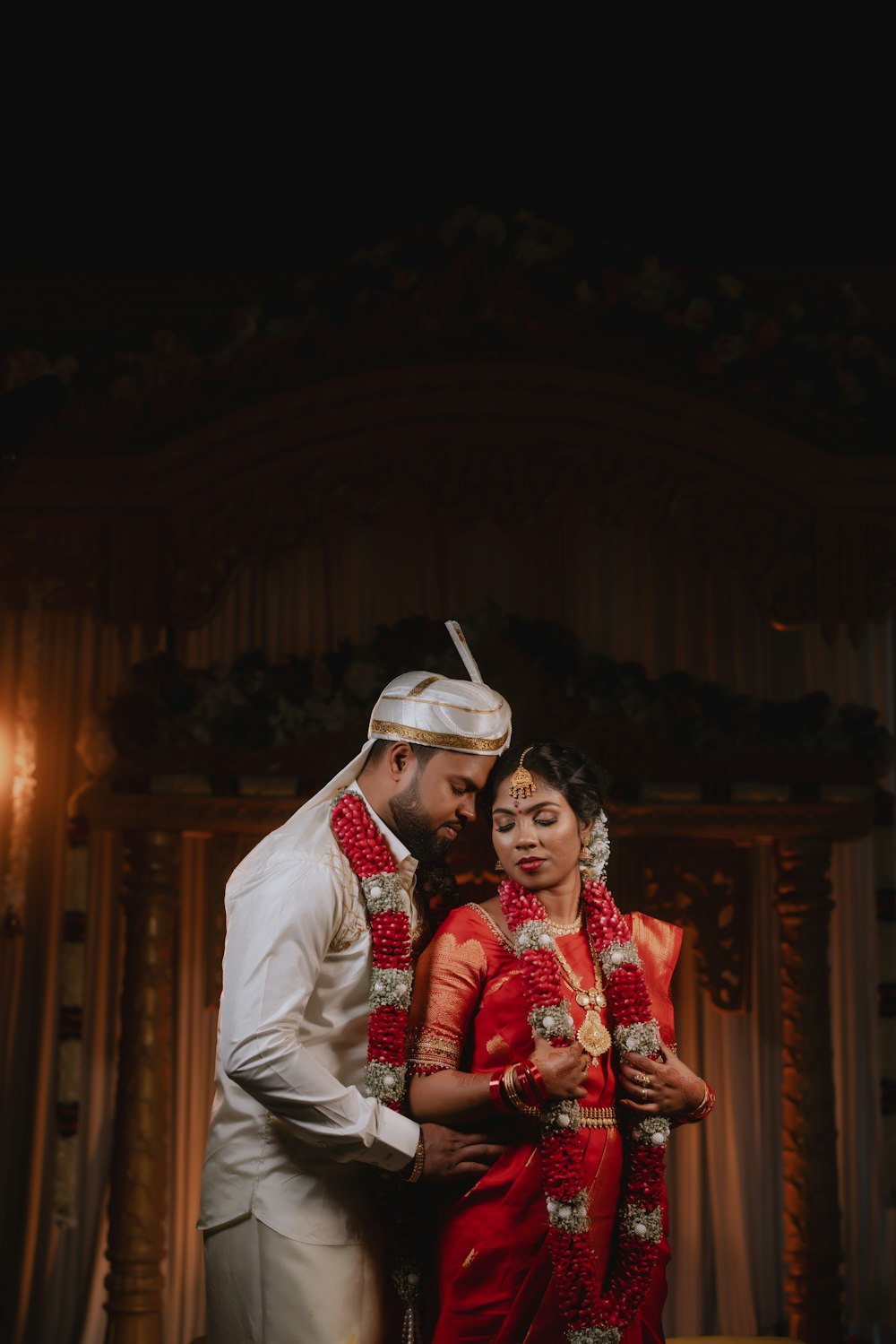 a man and a woman in traditional indian garb