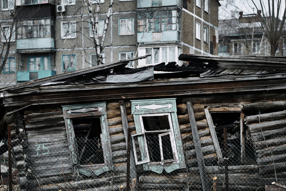 an old run down house with broken windows