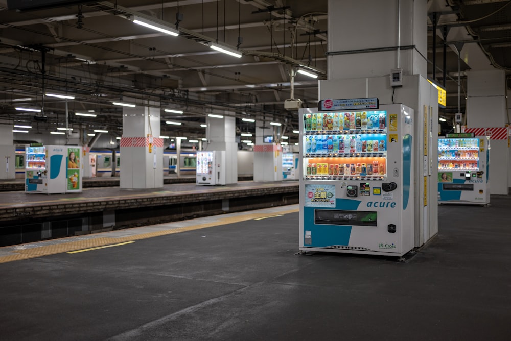 a vending machine sitting in a train station