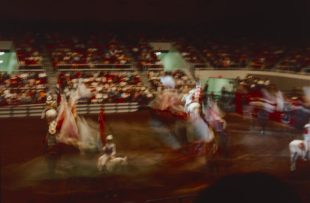 a group of people riding on the backs of horses