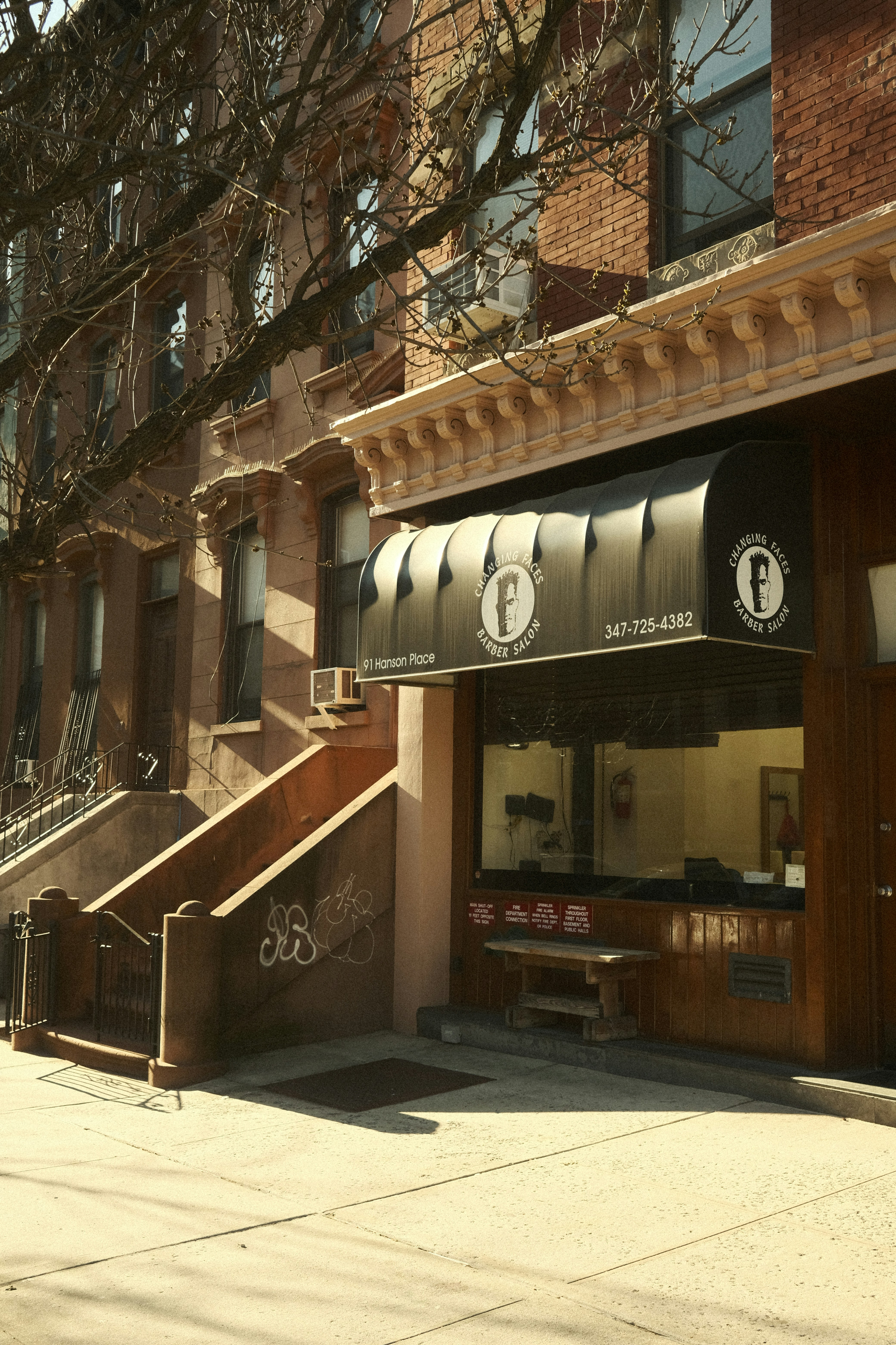 A building that has a sign on the front of it photo – Free Street ...