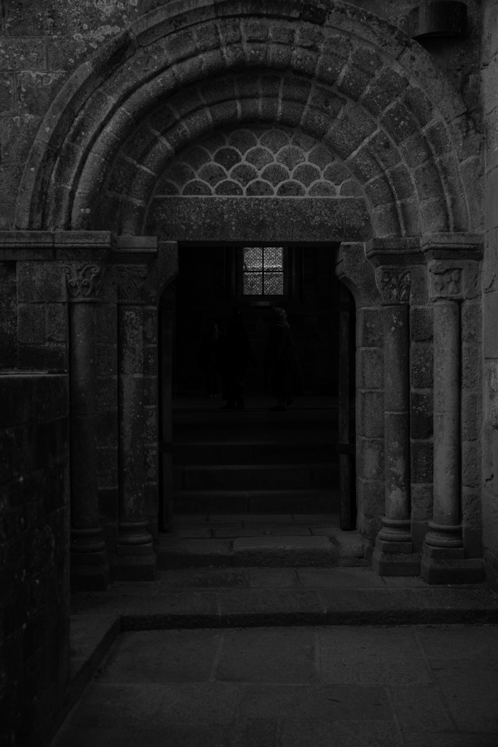 a black and white photo of a doorway