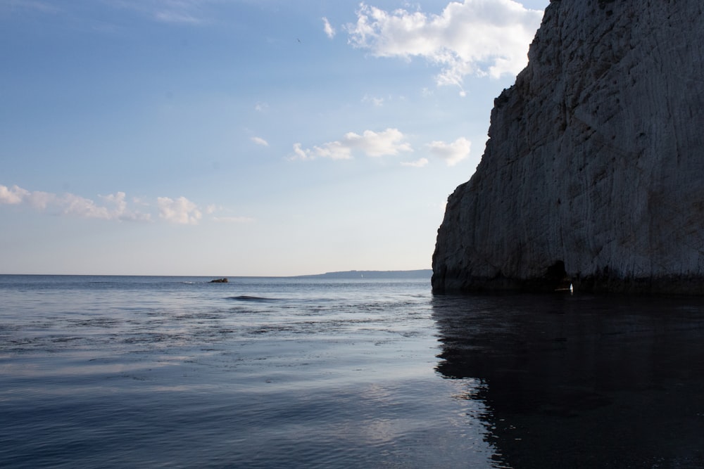 a large rock outcropping into the ocean