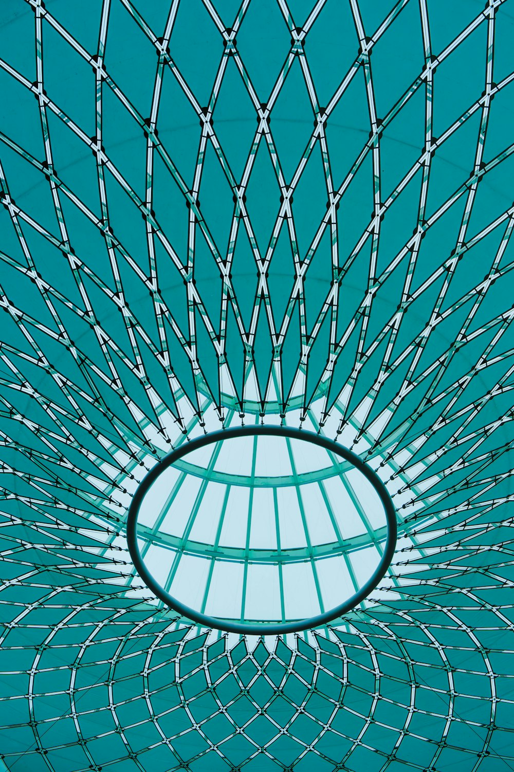 a circular metal structure with a blue sky in the background