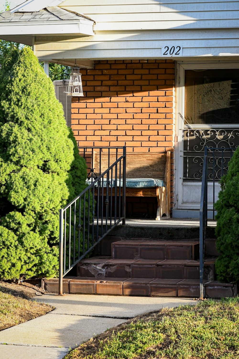 a house with a front porch and steps leading to the front door