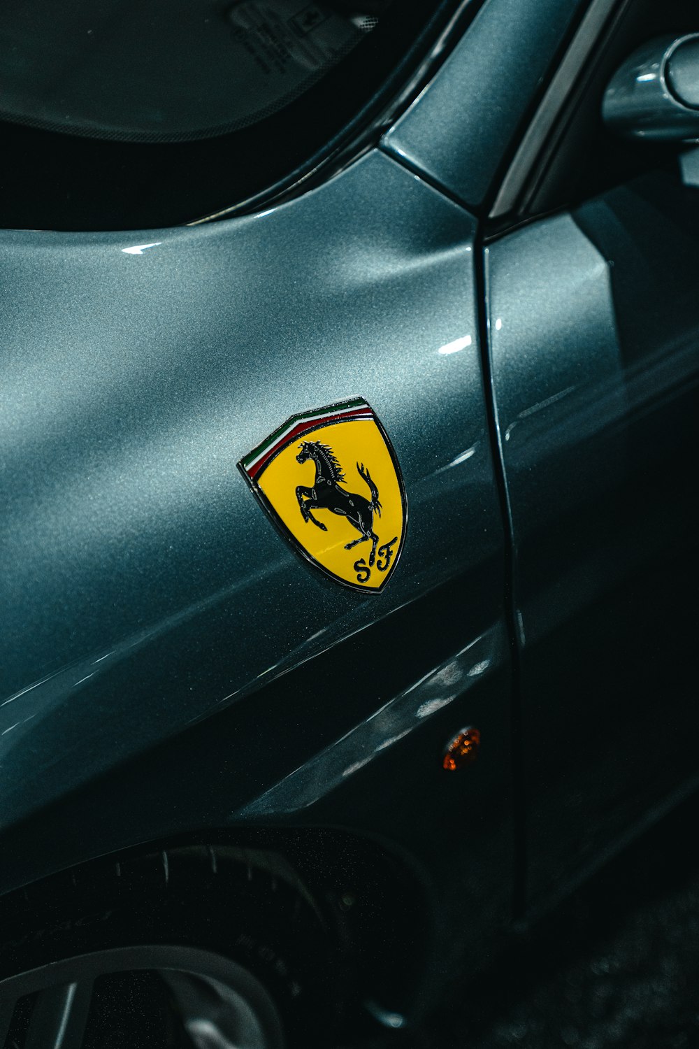 a close up of a car with a ferrari logo on it
