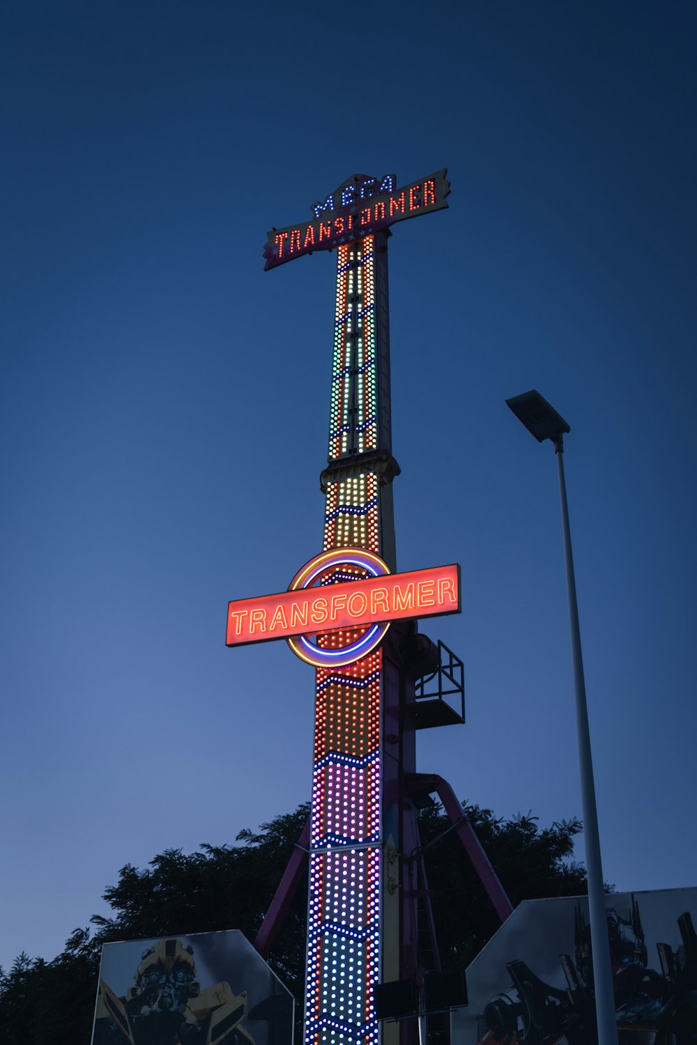 a tall tower with a sign on top of it