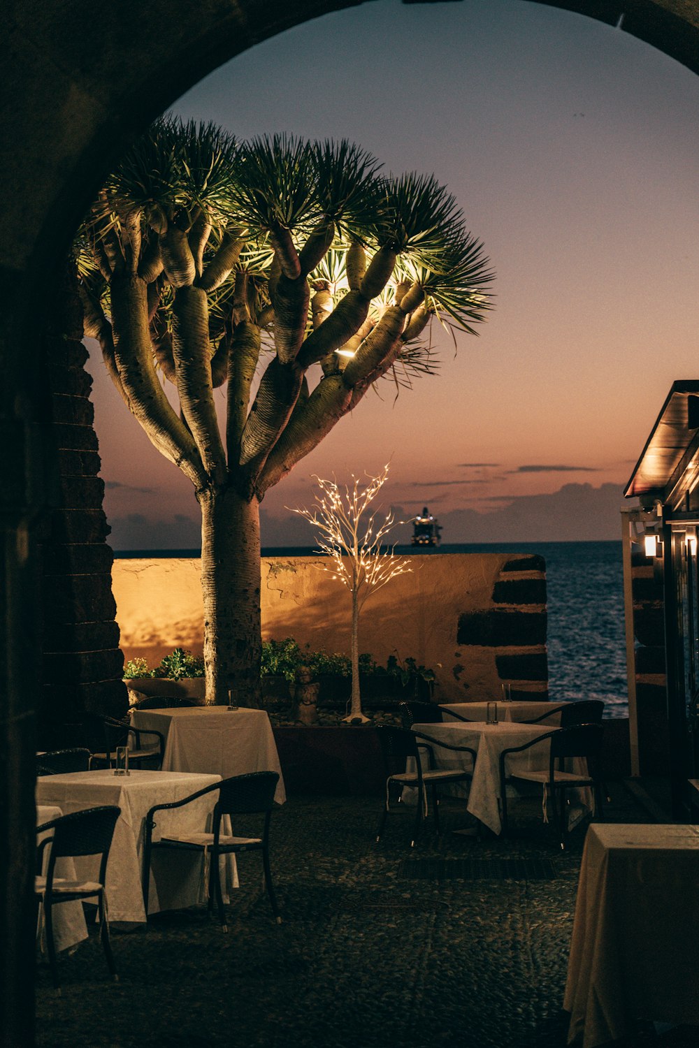 a restaurant with a view of the ocean