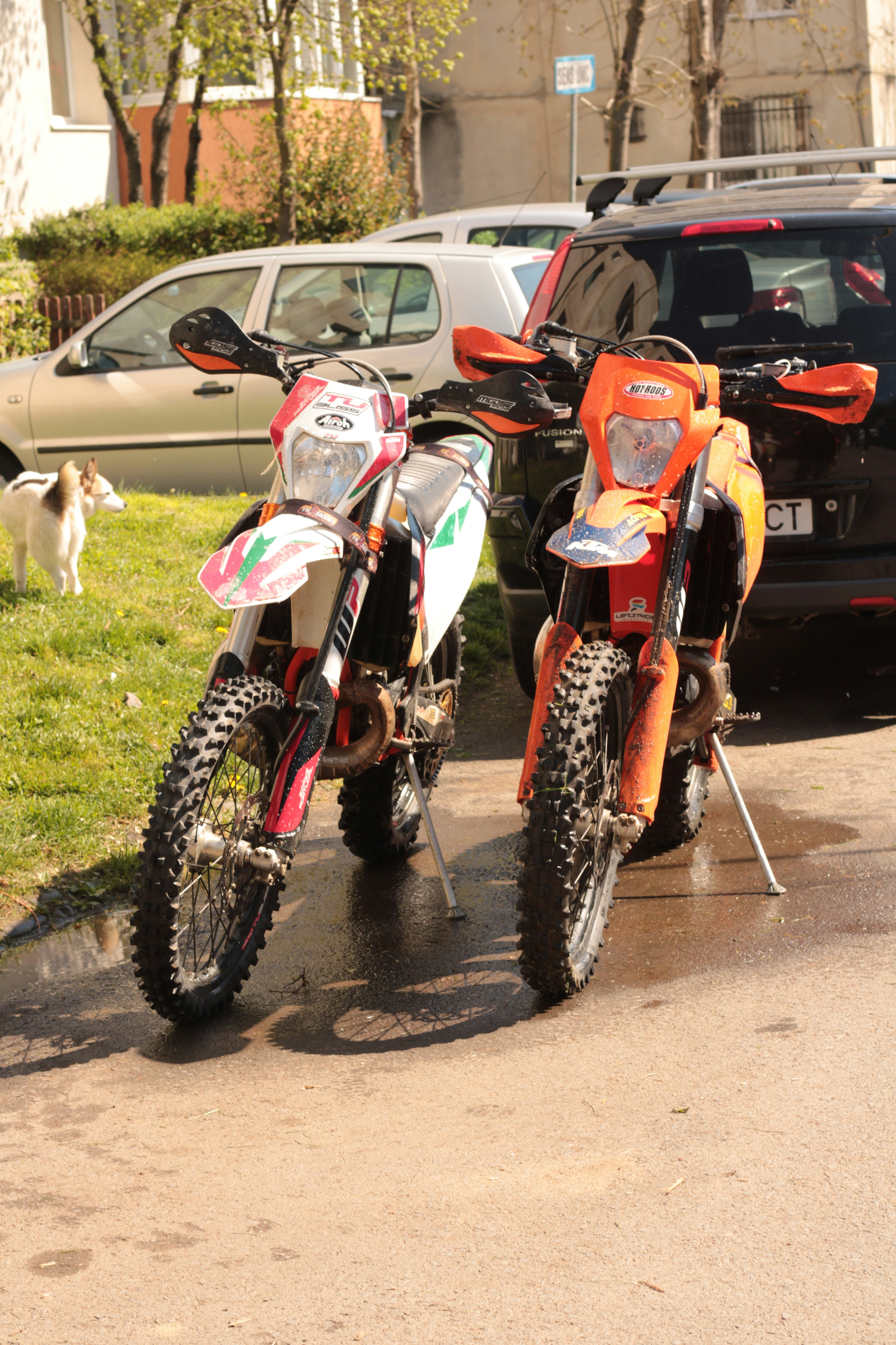 a couple of dirt bikes parked next to each other