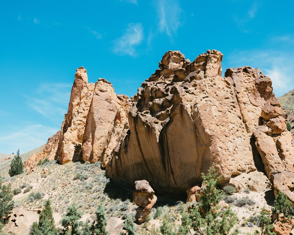 a large rock formation in the middle of a desert