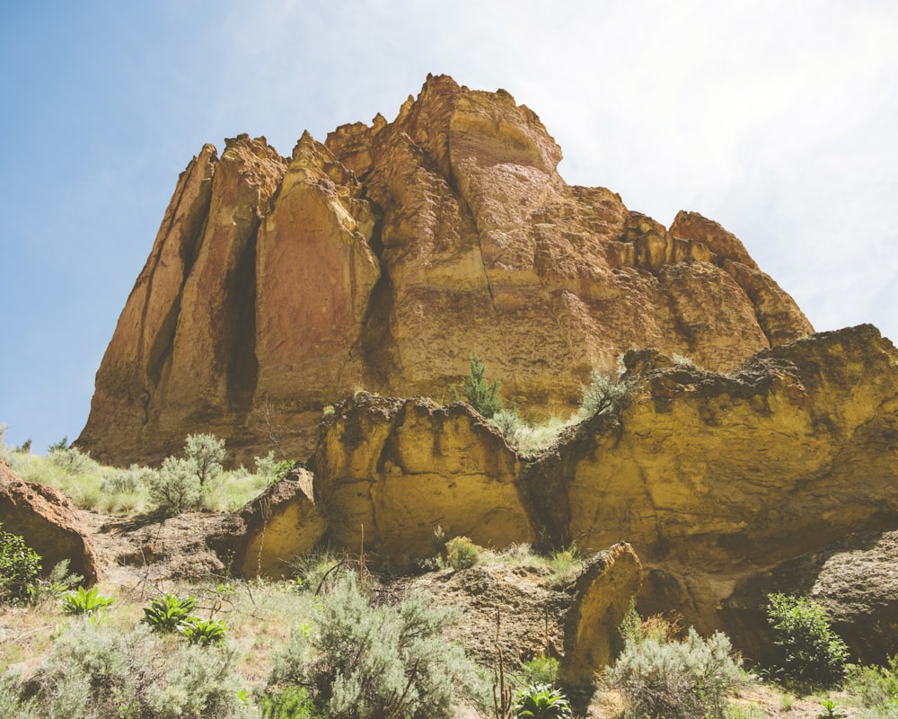 a large rock formation in the middle of a desert