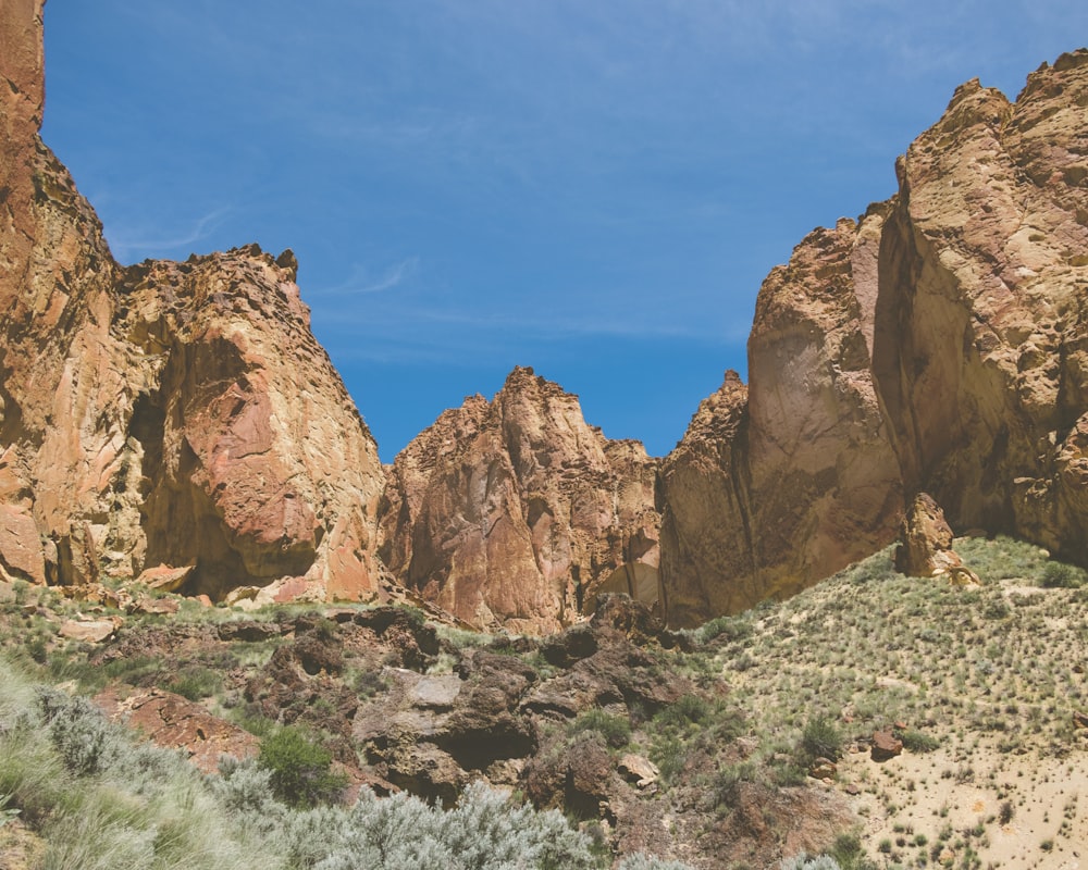 a group of large rocks in the middle of a desert