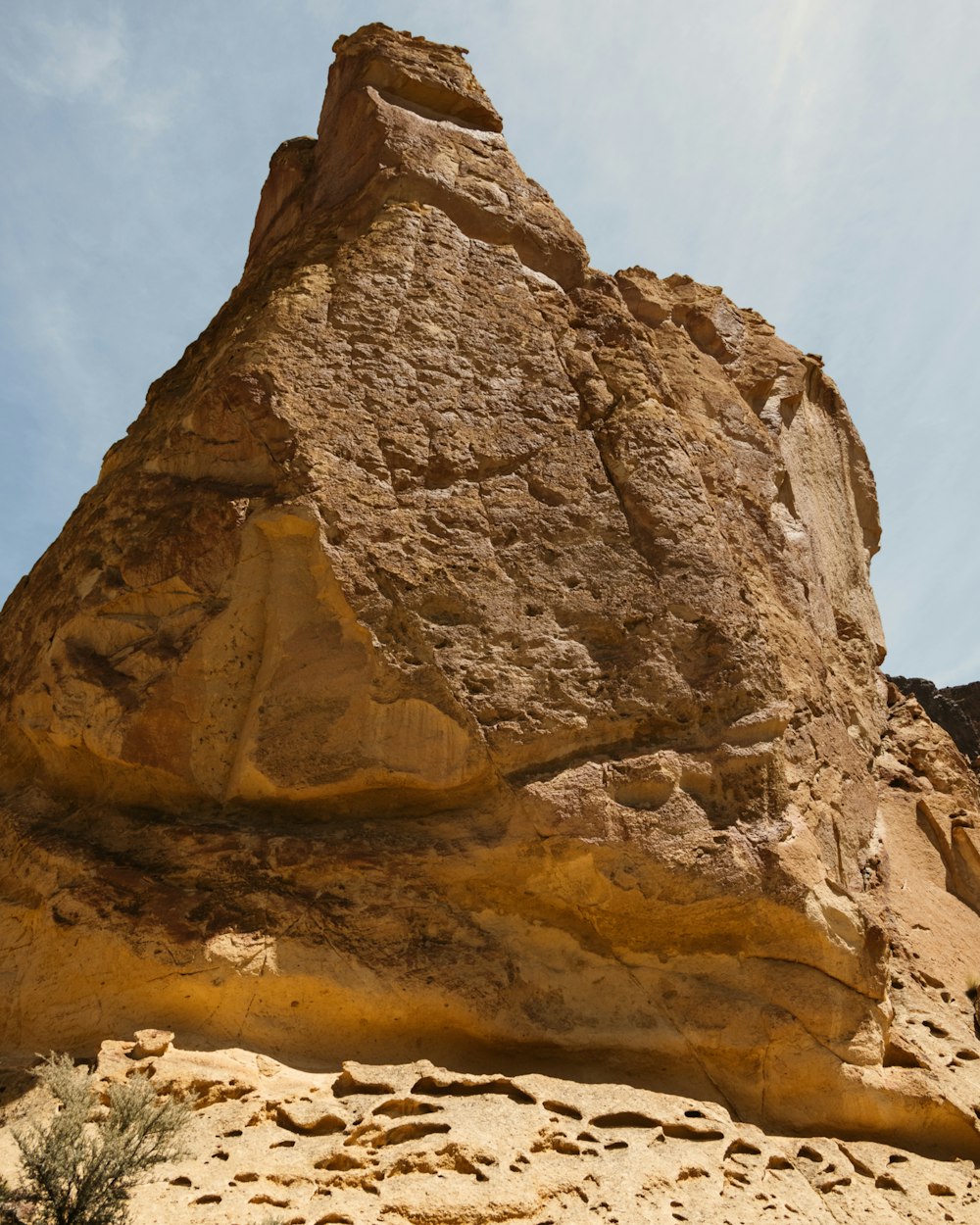 a large rock formation in the middle of a desert