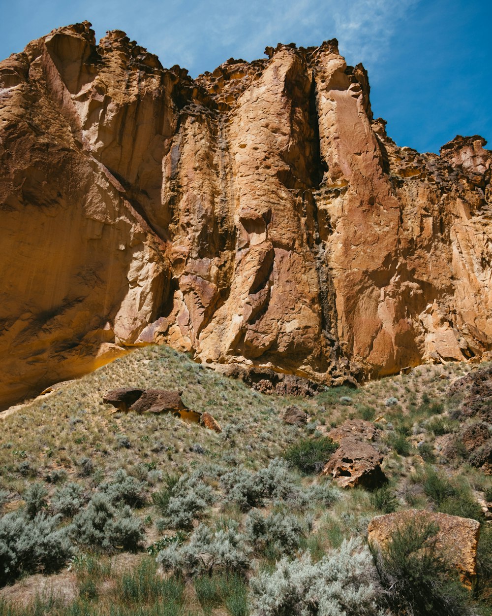 a large rock formation in the middle of a desert