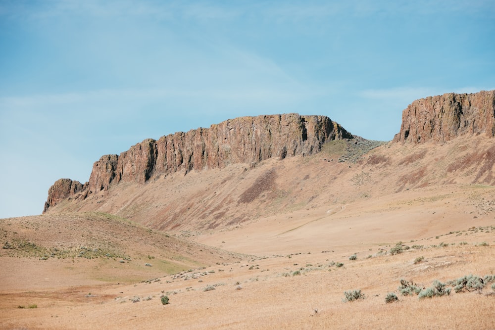 a mountain range in the middle of a desert