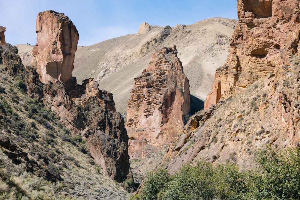 a group of rocks in the middle of a mountain range