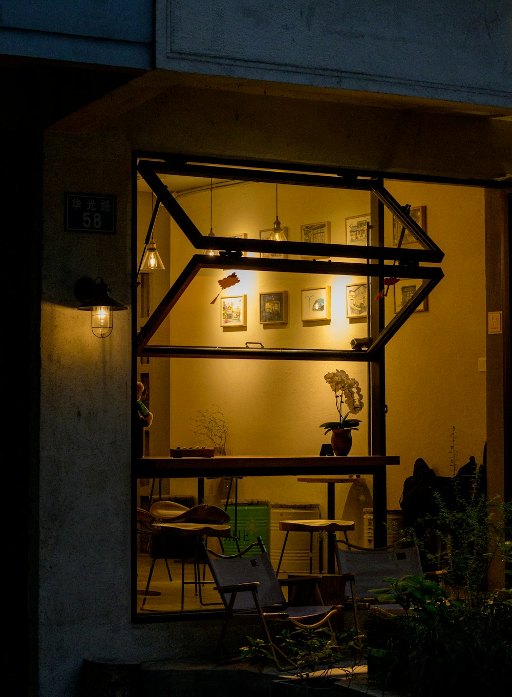 a room filled with lots of furniture under a window