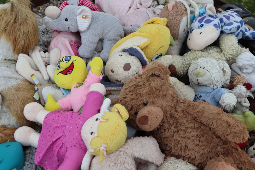 a pile of stuffed animals sitting next to each other