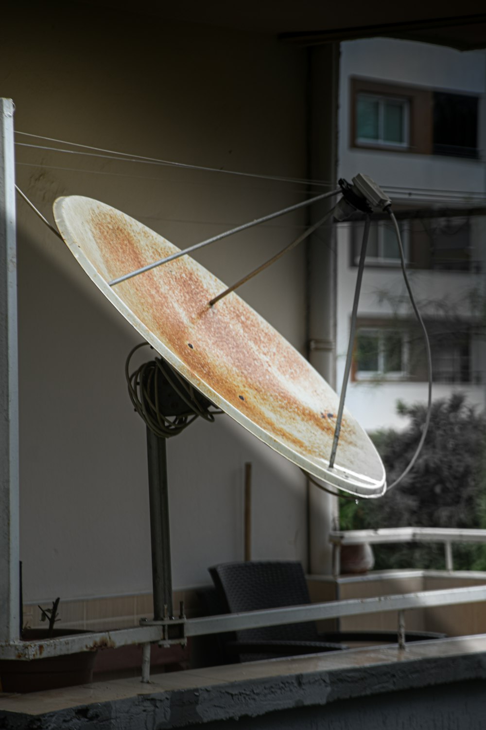 a surfboard hanging from a wire on a building