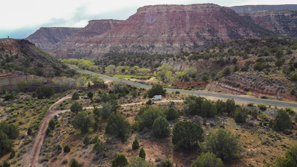 an aerial view of a road in the mountains