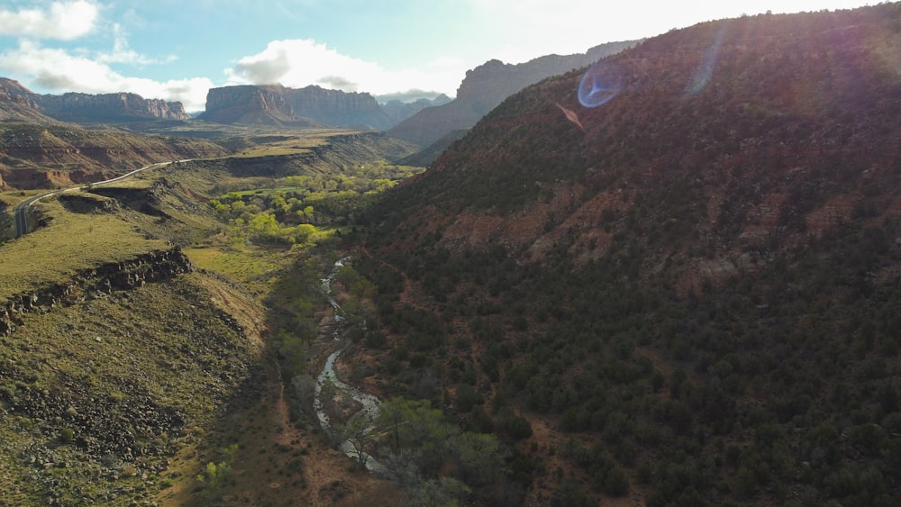 an aerial view of a valley with a river running through it