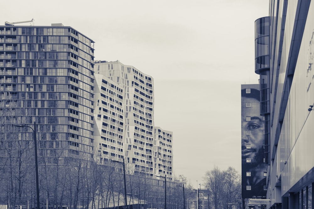 a black and white photo of tall buildings