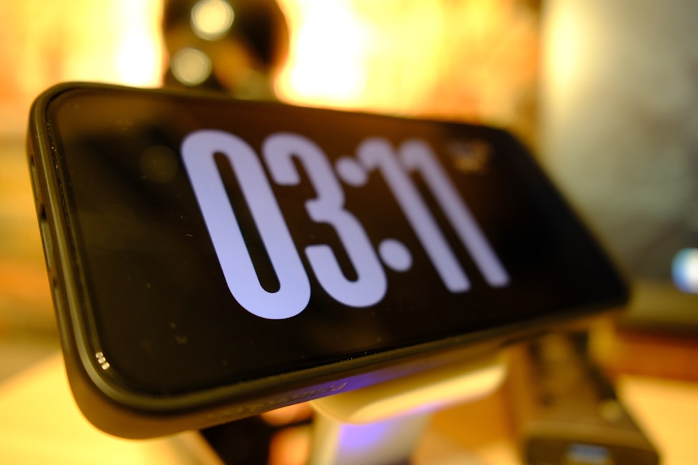 a close up of a clock on a table