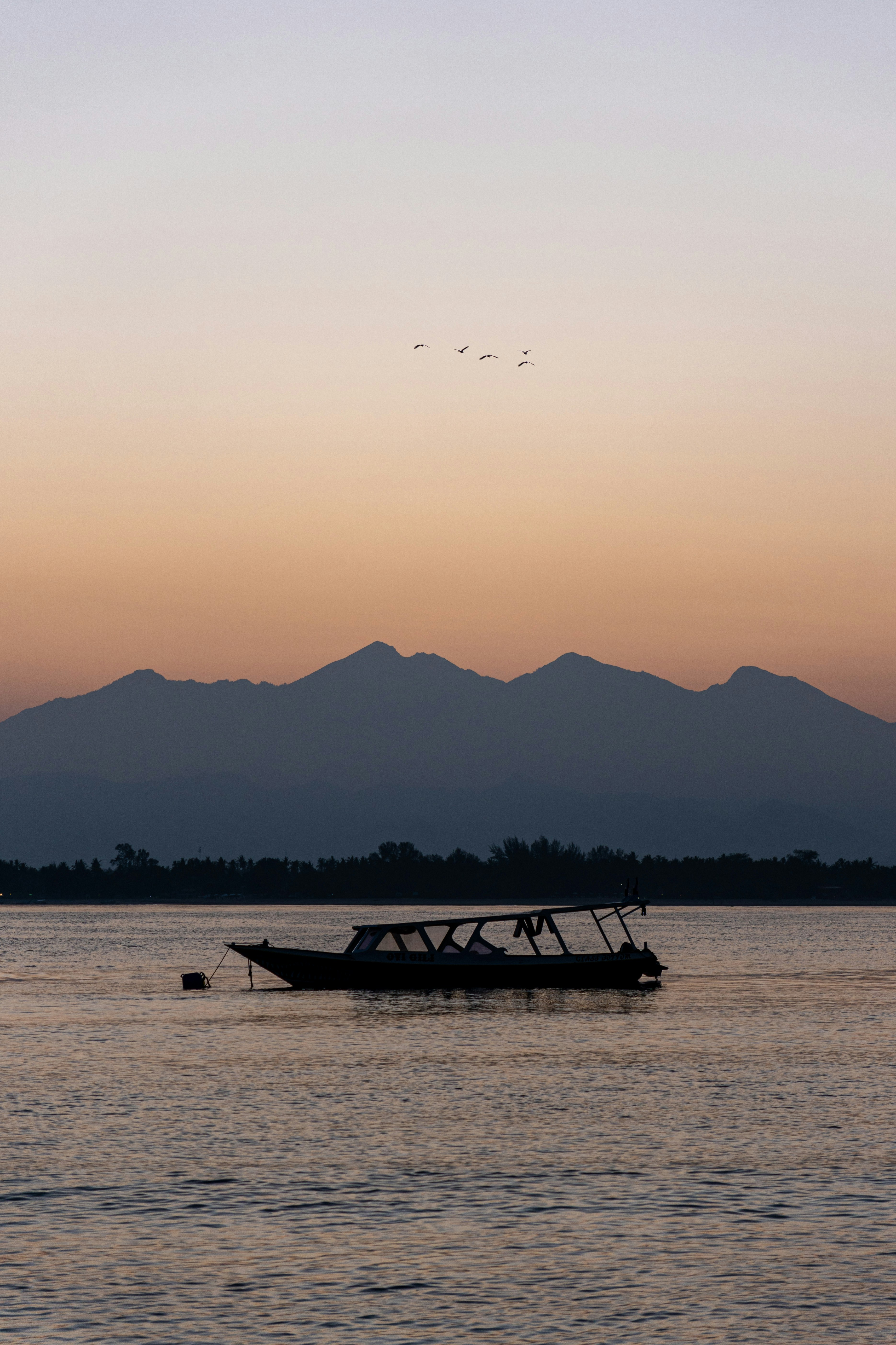 a boat floating on top of a large body of water