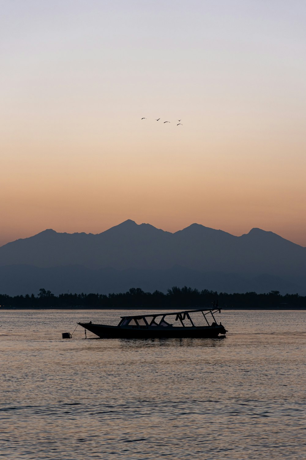 a boat floating on top of a large body of water