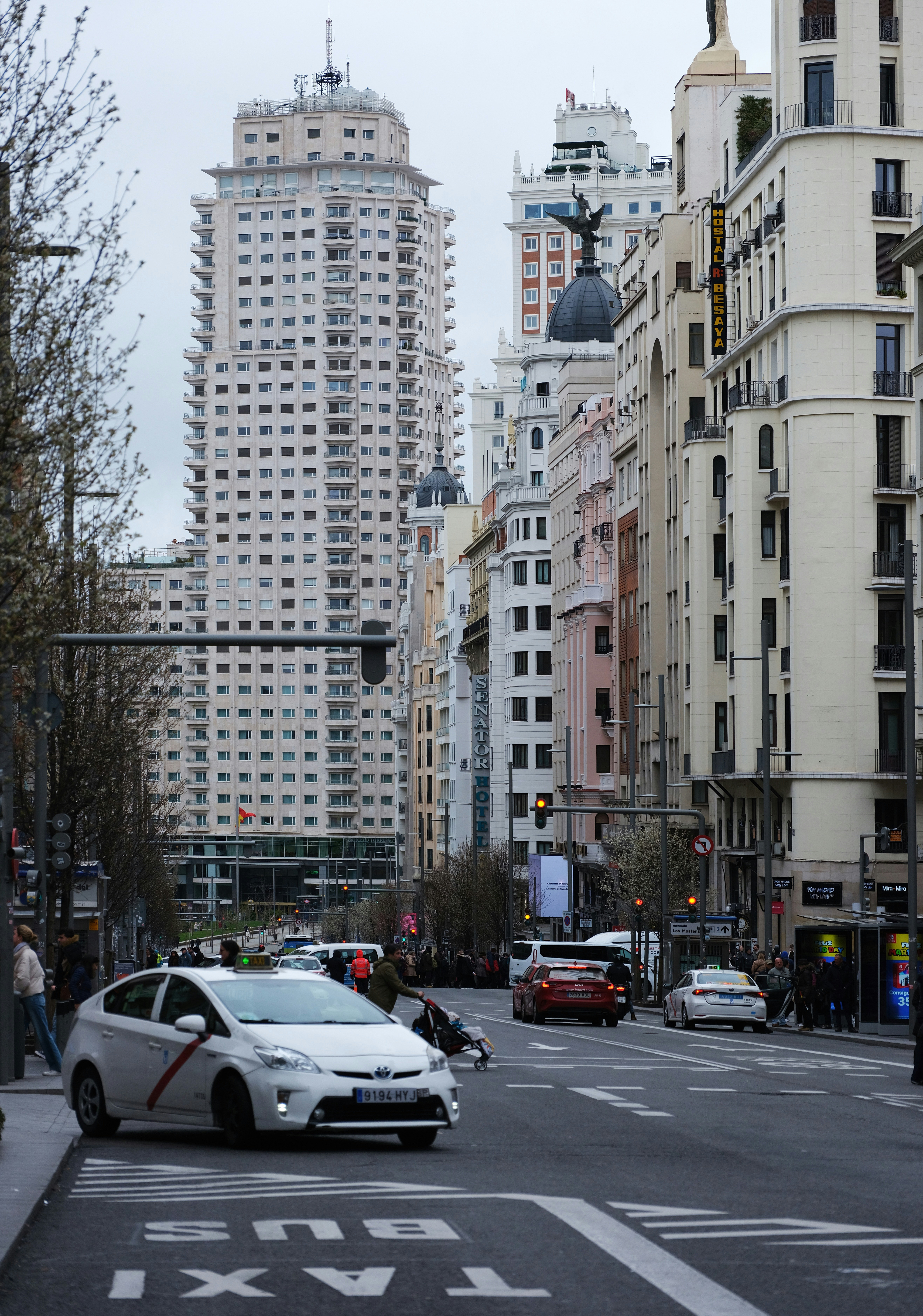 a city street filled with lots of tall buildings
