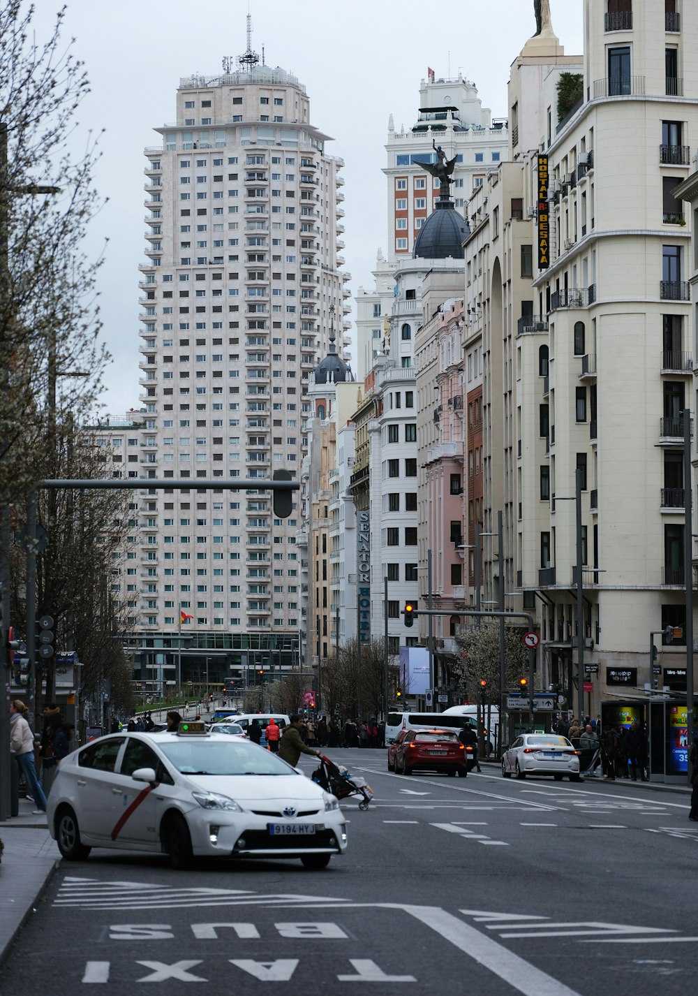 a city street filled with lots of tall buildings