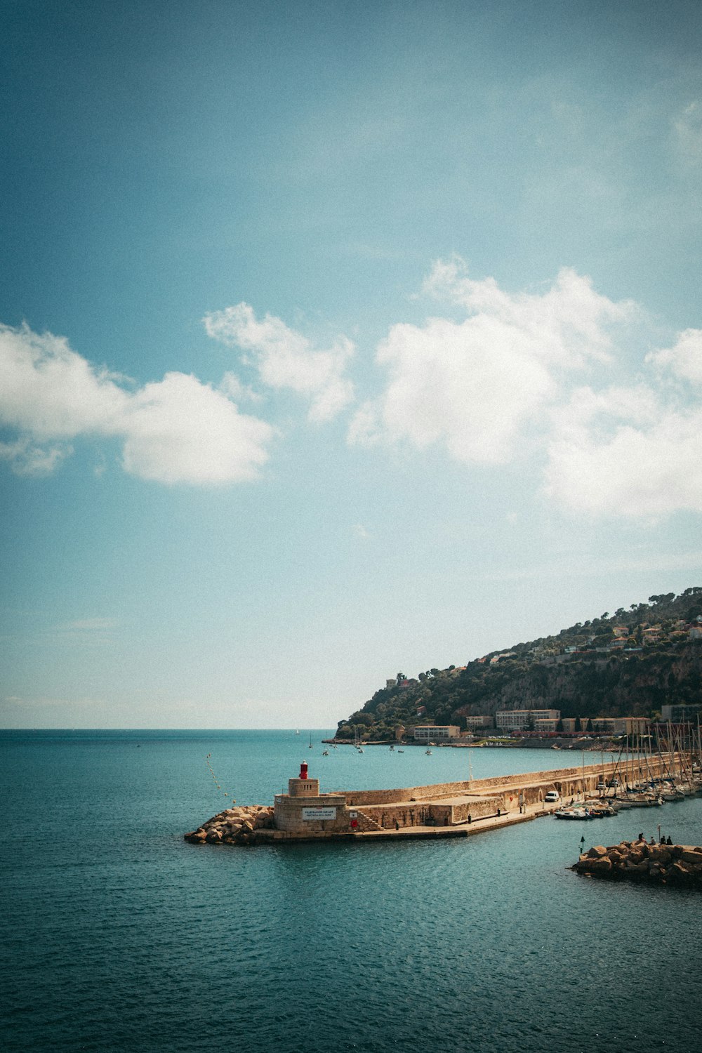 a large body of water with a boat in it