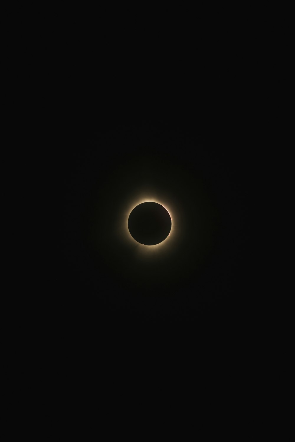 a solar eclipse is seen in the dark sky