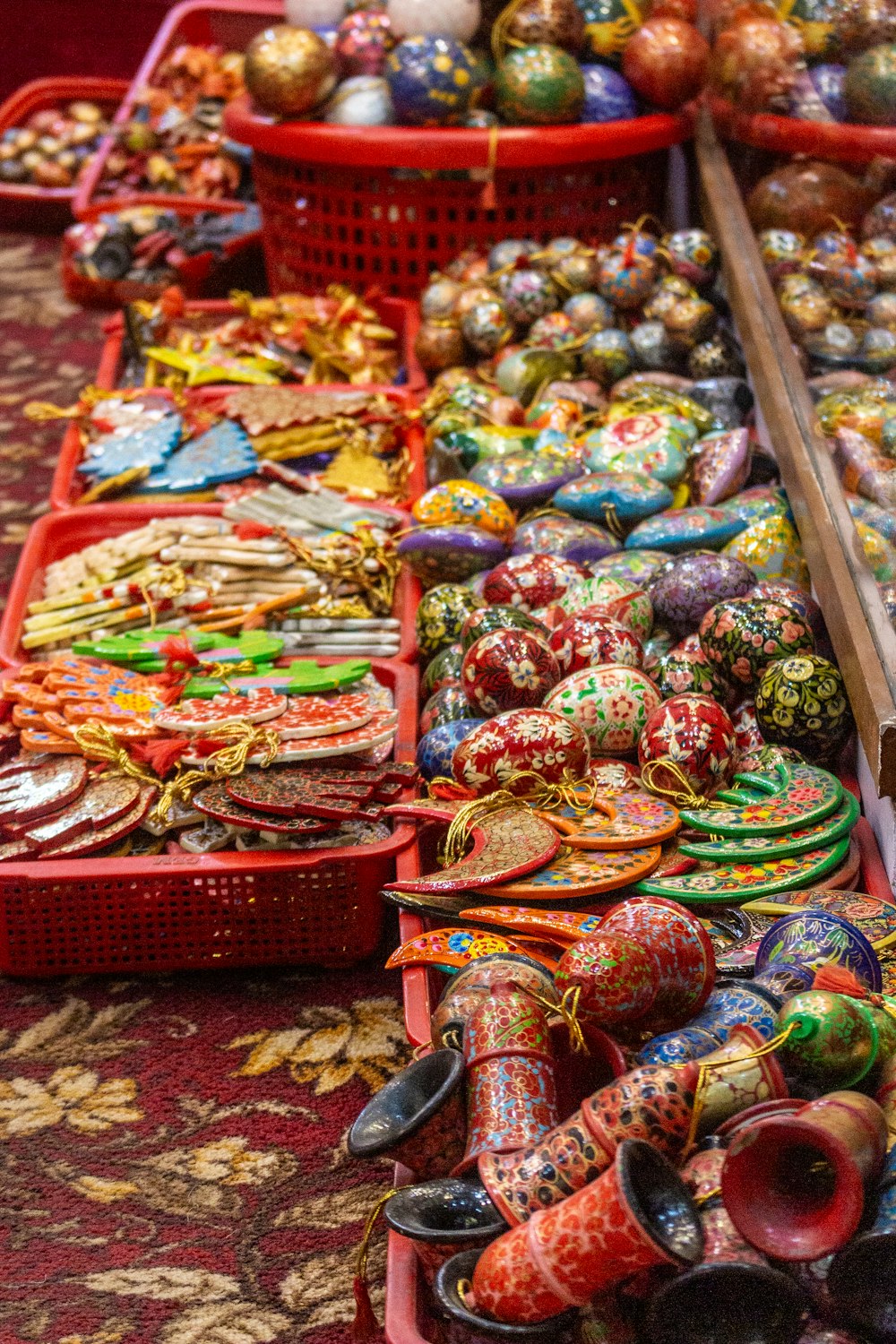 a bunch of baskets filled with lots of colorful items