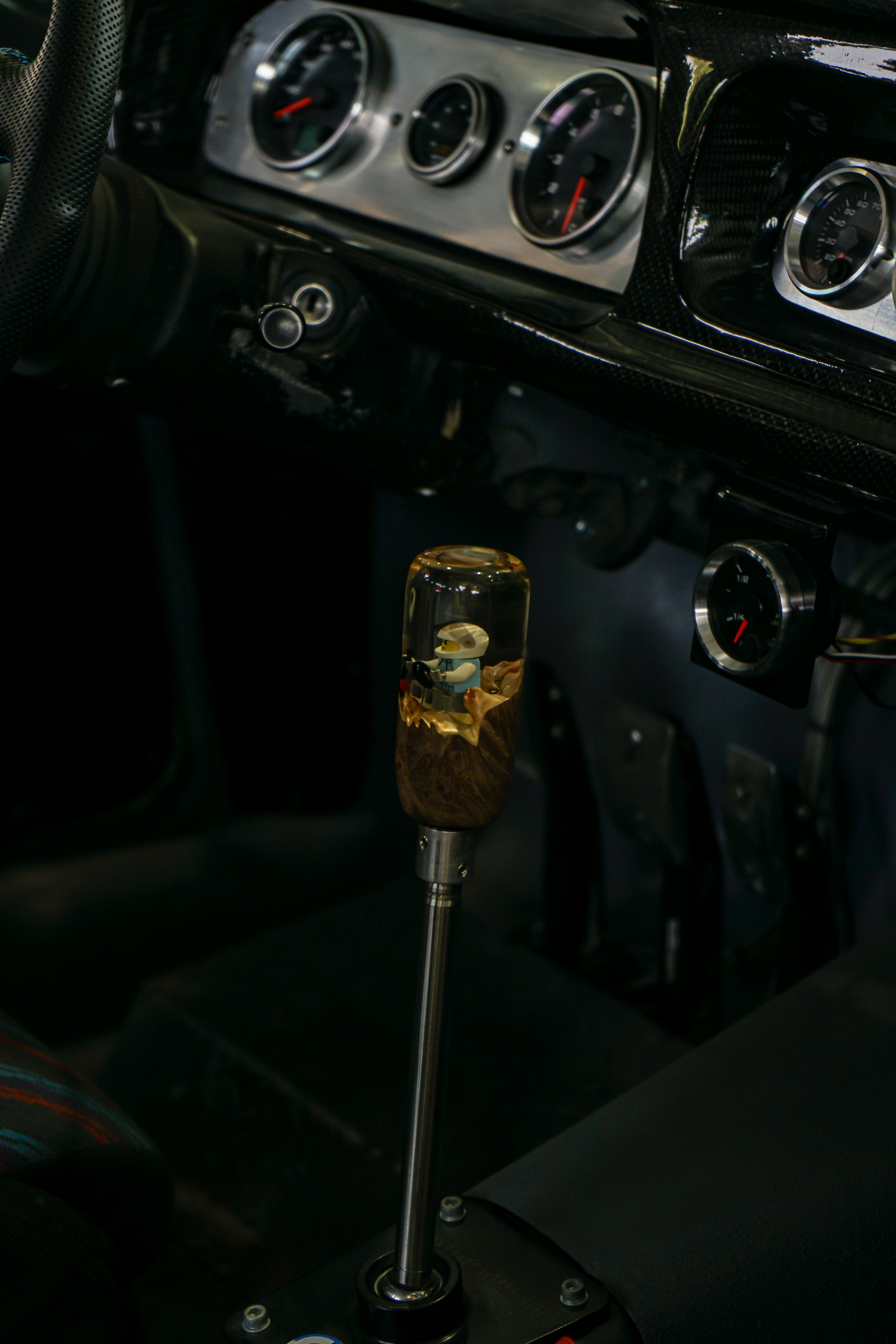 a close up of a steering wheel and dashboard of a car