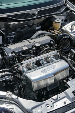 the engine compartment of a car with the hood open