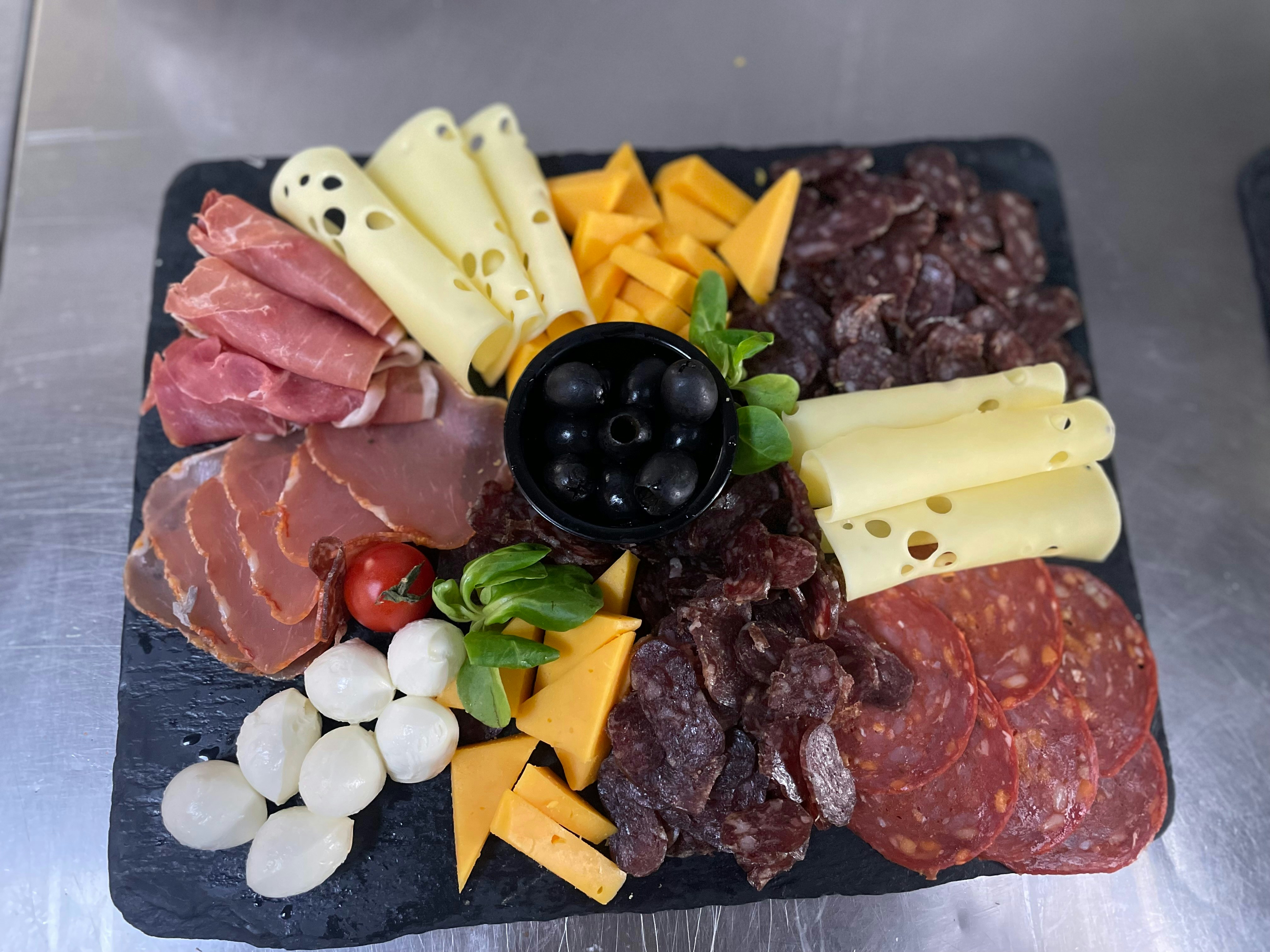 Italian charcuterie plate with Parma ham and fresh mozzarella