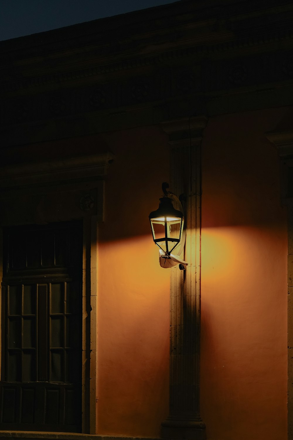 a street light on a building at night