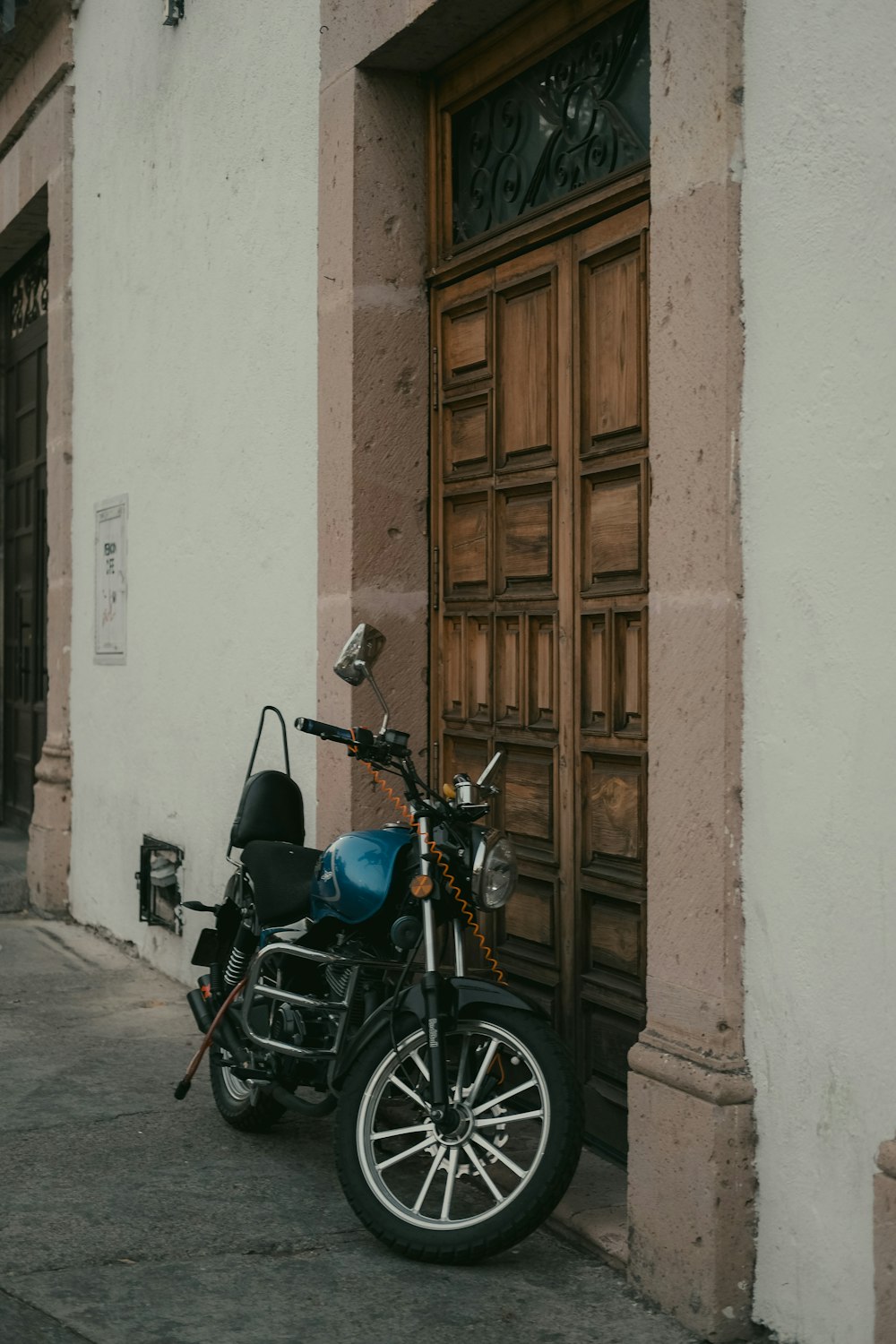 a motorcycle parked in front of a building