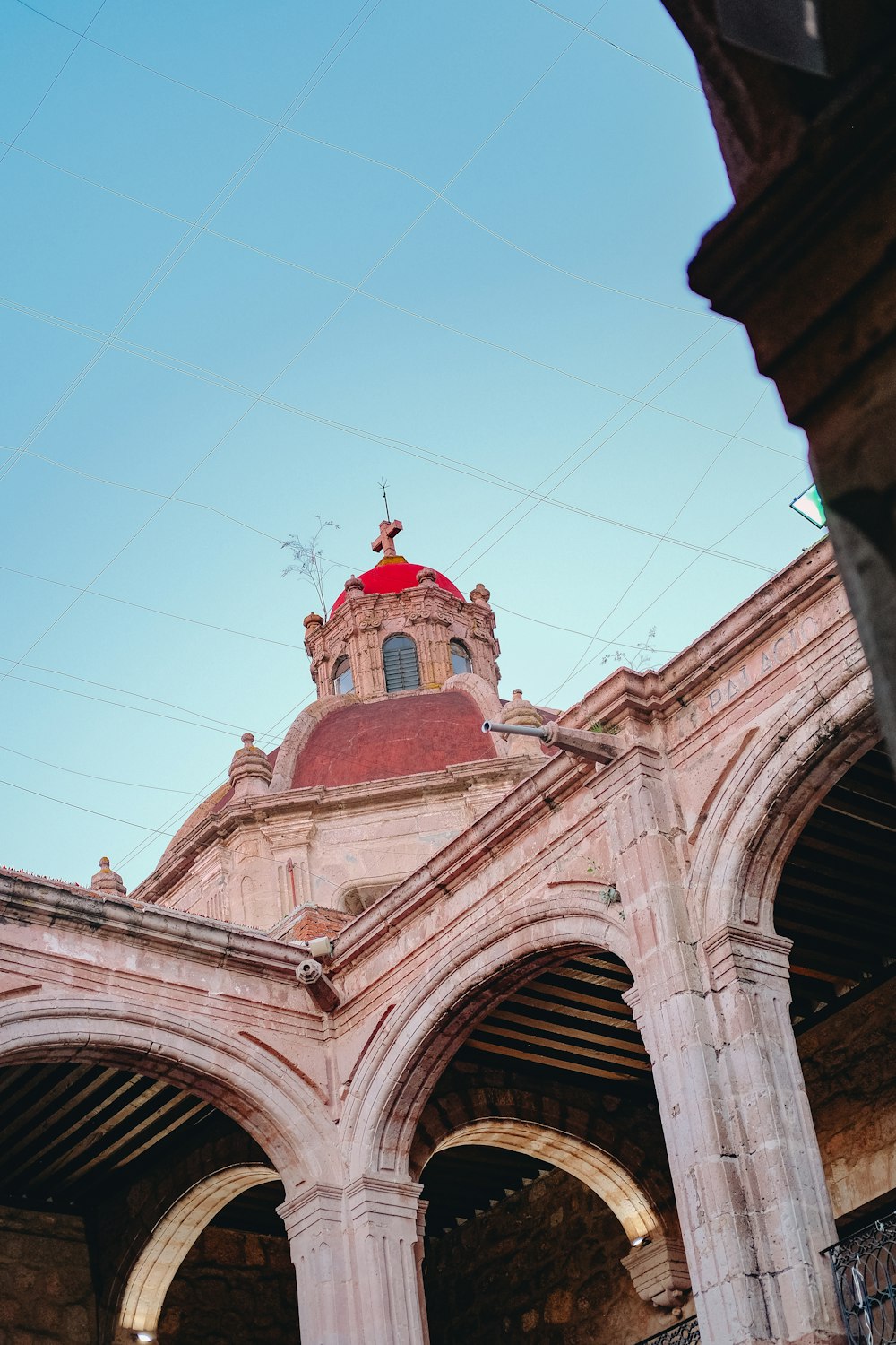 a building with arches and a clock tower