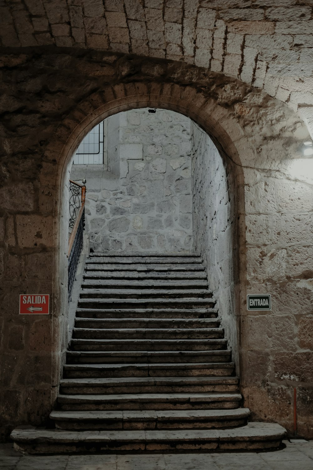 a set of stairs leading up to a stone building