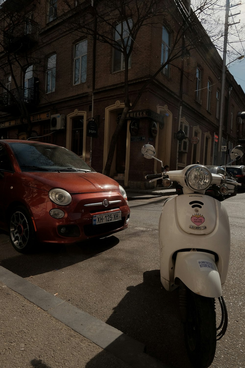 a scooter is parked on the side of the road