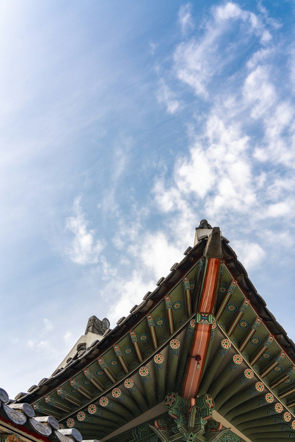 the roof of a building with a sky background