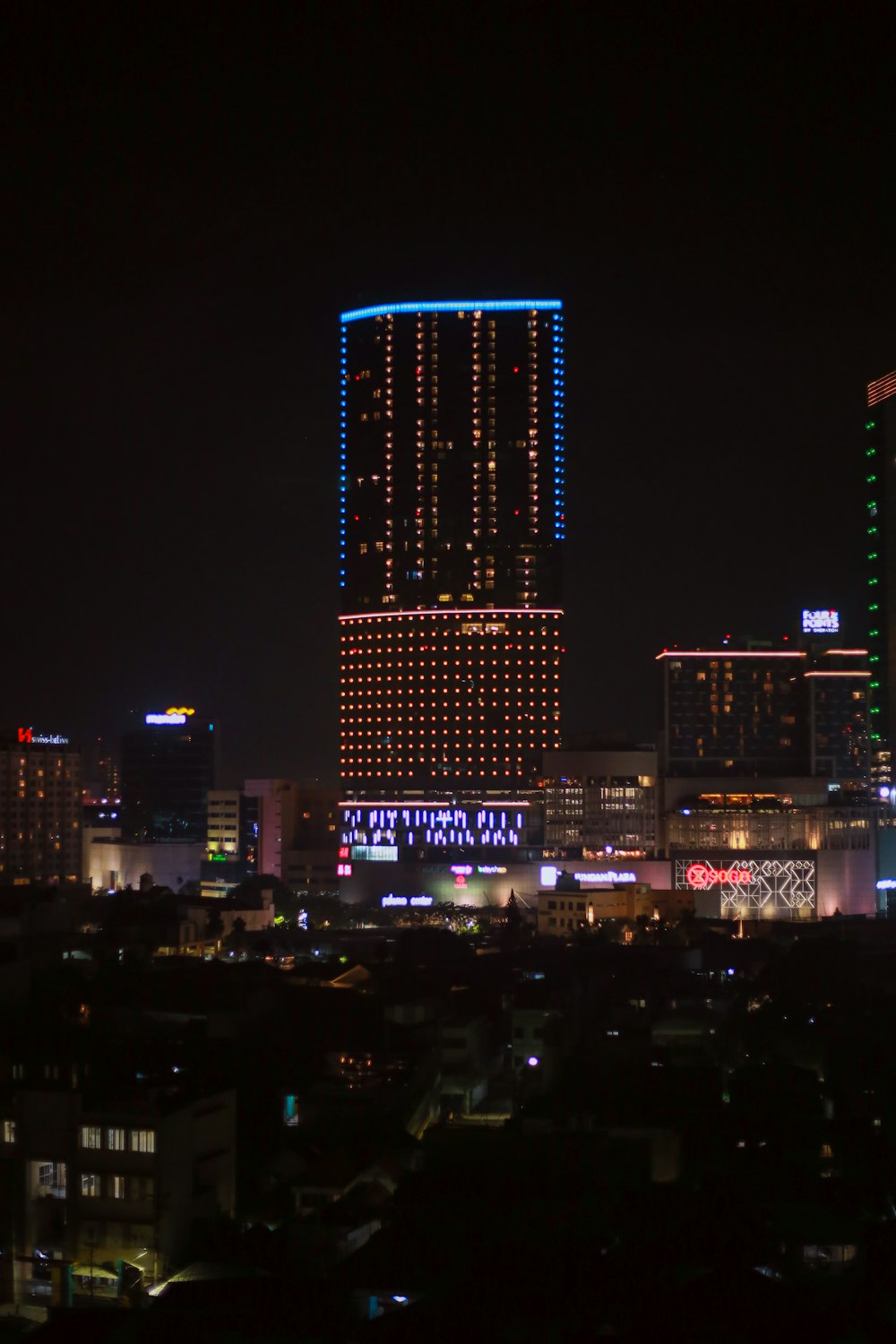 a view of a city at night from a distance