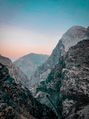 a view of a mountain range from the top of a mountain