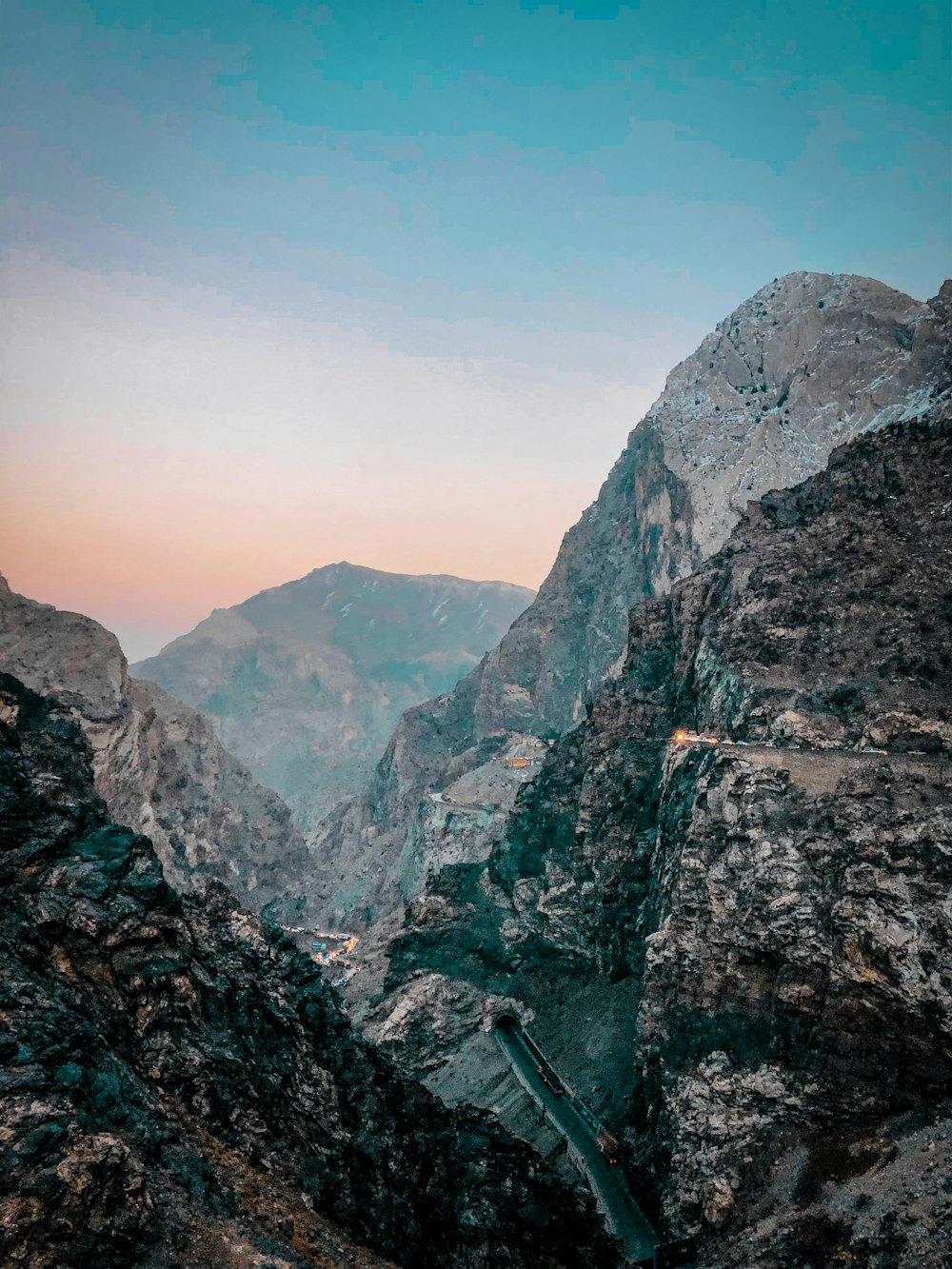 a view of a mountain range from the top of a mountain