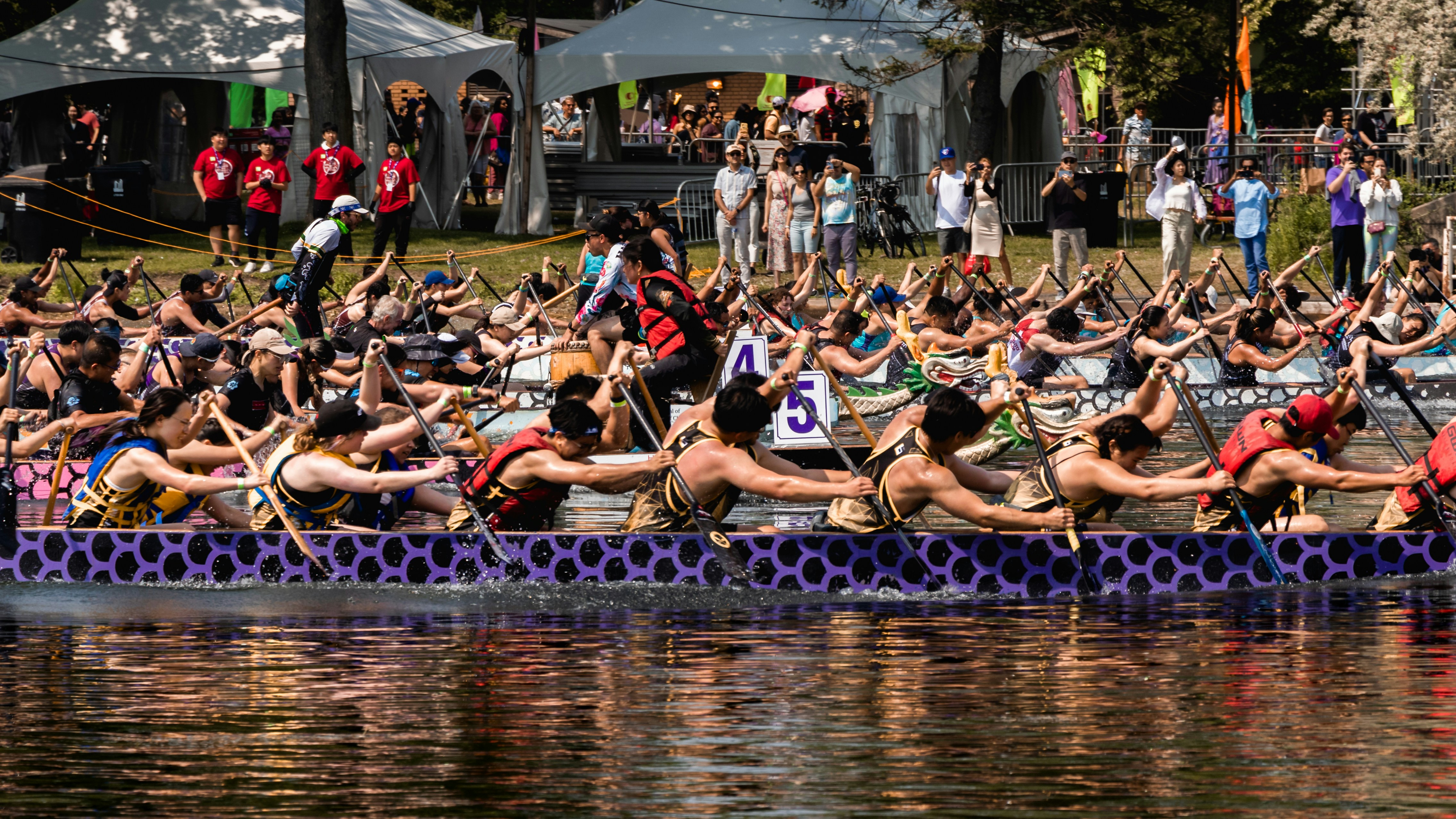 A group of people riding on the back of a boat photo – Free Water Image ...