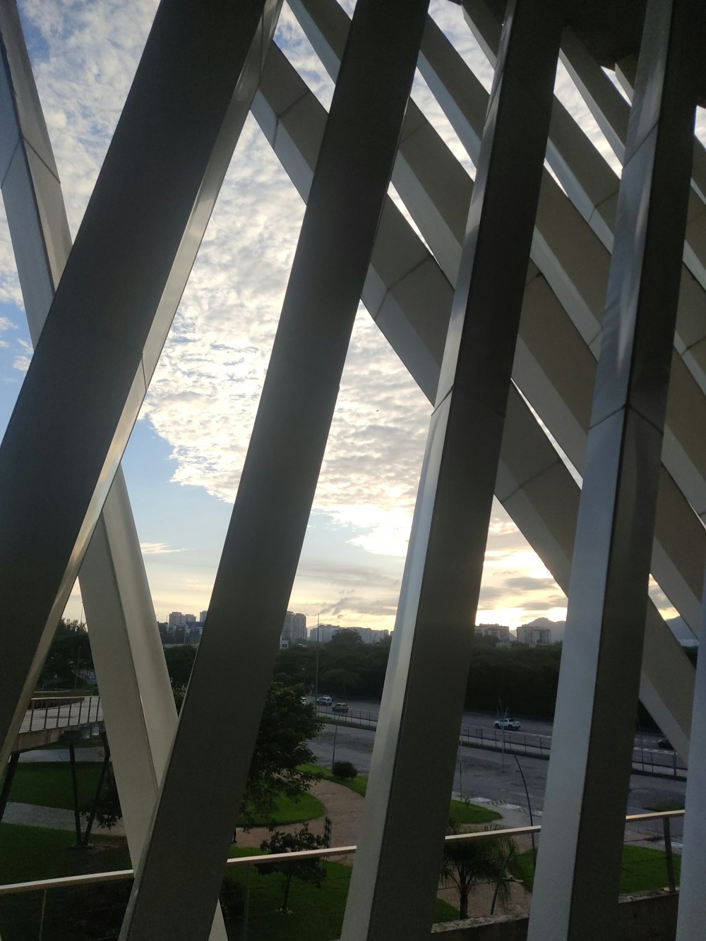 a large metal structure with a sky in the background