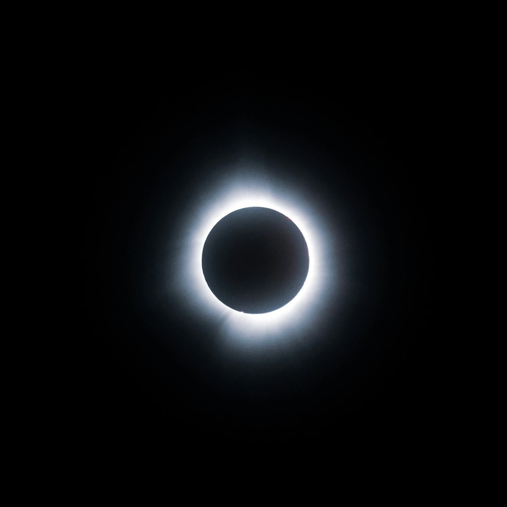 a solar eclipse is seen in the dark sky